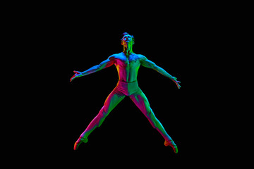 Banner with one attractive young male, ballet dancer jumping in air over dark studio background with neon light. Star pose