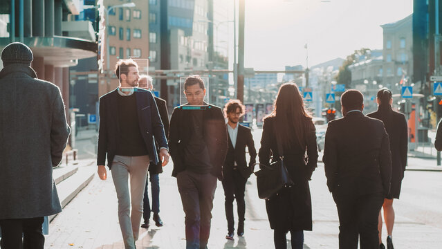 Crowd of Business People Tracked with Technology Walking on Busy Urban City Streets. CCTV AI Facial Recognition Big Data Analysis Interface Scanning, Displaying Personal Information.