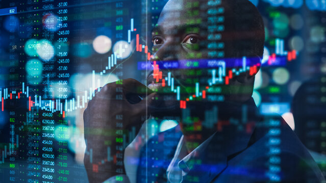 Portrait of Black Stock Market Trader Doing Analysis of Investment Charts, Graphs, Ticker Numbers Projected on His Face. African American Financial Analyst, Digital Entrepreneur Successfully Trading