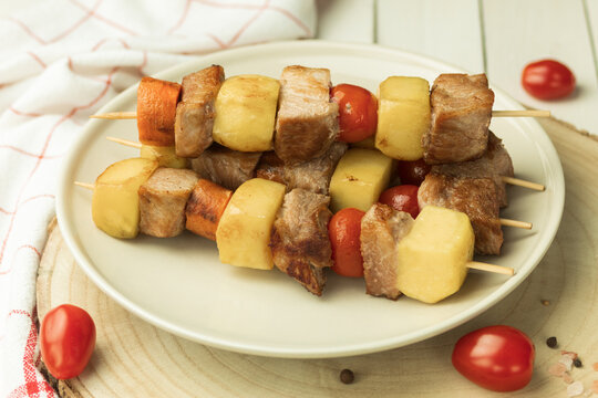 A dish of meat with potatoes and vegetables
