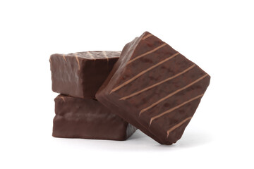Chocolate coated cakes isolated on white background. Chocolate cake cube. Chocolate coated snacks.