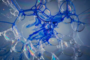 A closeup shot of soap bubbles with blue details