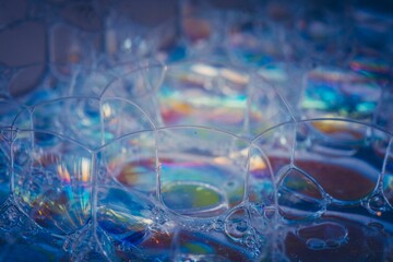 A closeup shot of soap bubbles with blue details
