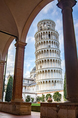 Leaning tower of Pisa, Italy, framed in the unusual perspective of the arches and columns