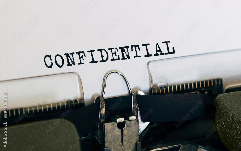 Poster text confidential typed on retro typewriter