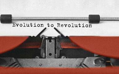 Text Evolution to Revolution typed on retro typewriter