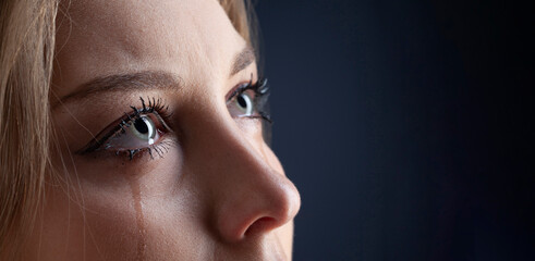 Face of crying woman with tears. Close up