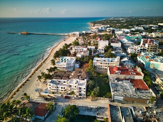 Fototapeta premium Aerial of Playa del Carmen town skyline surrounded by a sandy beach and the sea