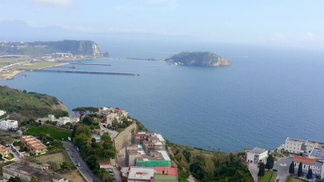 Aerial view of the island of Nisida. It is located in Naples, Italy. Nisida is a volcanic islet of the Flegrean Islands archipelago. It is connected to the city by a long pier.