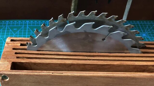 steel circular saws in a wooden box on a table in a workshop