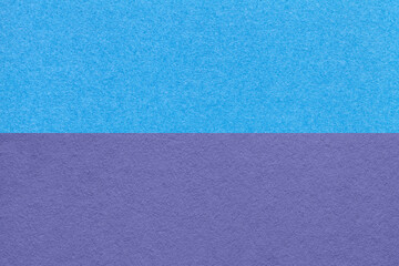 Texture of craft blue and violet paper background, half two colors, macro. Vintage very peri and turquoise cardboard.