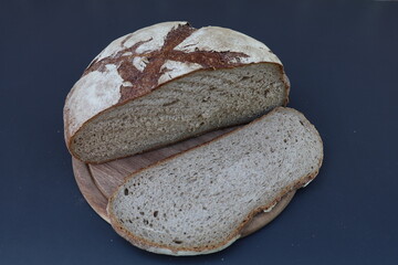 half a load of stone baked bread with a single slice cut off