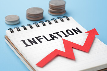 Inflation rate increasing concept with stack of coins