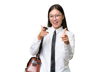 Fototapeta premium Young Asian business woman over isolated background pointing to the front and smiling