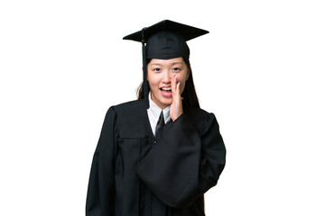 Young university graduate Asian woman over isolated background shouting with mouth wide open