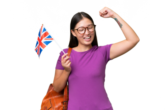 Young Asian woman holding an United Kingdom flag over isolated background celebrating a victory