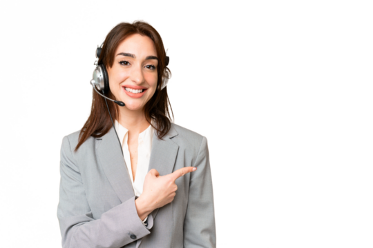 Telemarketer caucasian woman working with a headset over isolated chroma key background pointing to the side to present a product