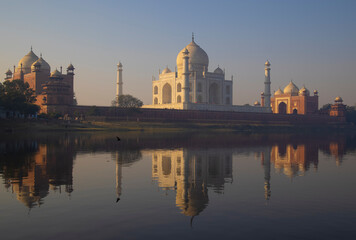 mausoleum of the Taj Mahal reflected on the river Yamuna