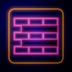 Glowing neon Bricks icon isolated on black background. Vector