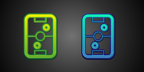 Green and blue Air hockey table icon isolated on black background. Vector