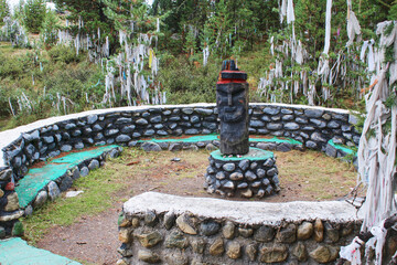 Ritual wooden idol statue, sacred place of worship. Spirits of Altai