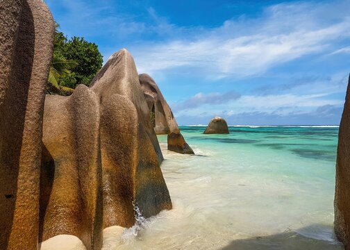 Idyllic tropical beach with amazing rock formations and turquoise water on sunny day in summer - Powered by Adobe