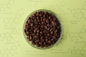 Roasted organic coffee beans from Tanzania in a round vessel on the background of organic molecules...