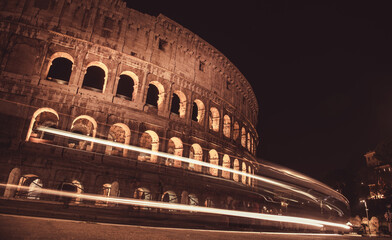 Rome, Italy at the Colosseum Amphitheater at night. Long exposure photo.