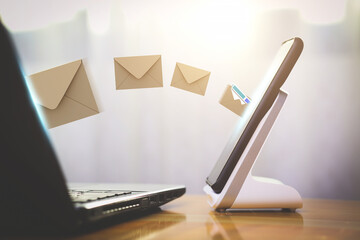 Electronic mail and network transmission connected online. laptop sends Digital letter file to...