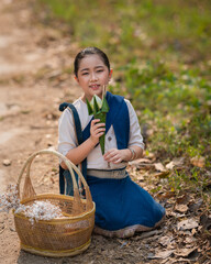 Beautiful Asian girl of rural villagers wearing the traditional classical Thai dress Northern of...