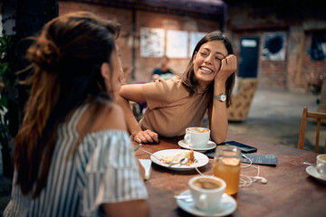 Young beautiful women having coffee and feeling joyful in cafe.