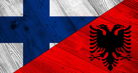Background with flag of Finland and Albania on split wooden board. 3d illustration