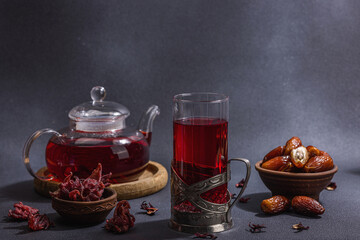 Hibiscus hot tea with dates. Traditional Ramadan Kareem concept snack for Iftar or Suhoor meal
