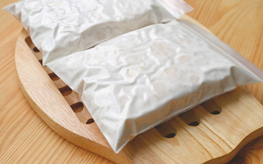 Closeup of Tempeh after Soybeans Fermented in Perforated Bags Covered with Thick and Dense White Mycelium