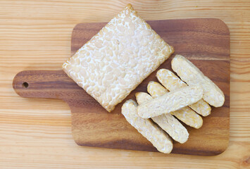 Whole and Sliced Fresh Tempeh, a High Plant Protein Source for Whole Foods Plant-based Diet
