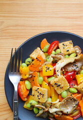 Plate of Colorful Vegetable Salad with Roasted Tempeh Cubes and Oyster Mushrooms
