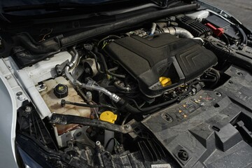 Obraz na płótnie Canvas Closeup of the car hood displaying the engine compartment
