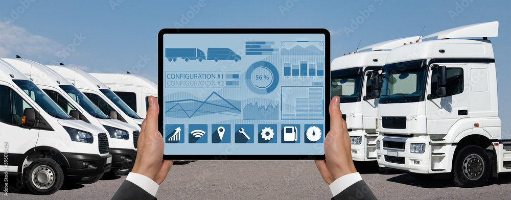 Aufkleber manager with a digital tablet on the background of vans and trucks. fleet management