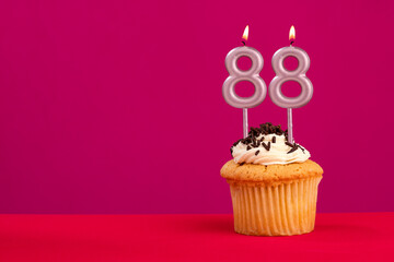 Birthday cake with candle number 88 - Rhodamine Red foamy background
