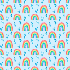 Hand drawn seamless pattern with funny cute rainbows with multicolored spectrum gradient and rain drops on blue. Illustrated background for print fabric, cards and design