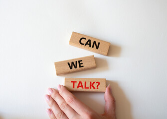 Can we talk symbol. Concept word Can we talk on wooden blocks. Businessman hand. Beautiful white...