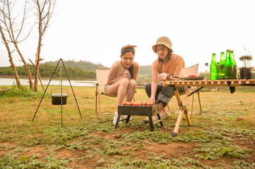 young pretty Asian woman  enjoy camping