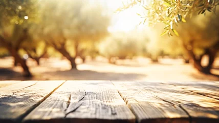 Poster Wooden empty table top, texture board panel against the backdrop of green olive orchard trees, defocused olive trees © ximich_natali