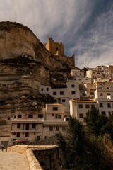 Picturesque view of Alcala del Jucar village in Spain bathed in a natural warm light