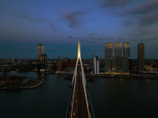 Fototapeta premium rotterdam citscape near by Erasmus bridge. Amazing colorful photo in sunset time.