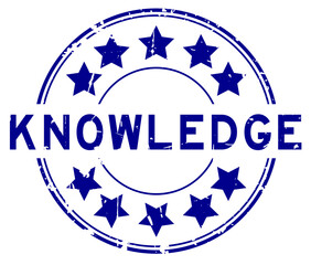 Grunge blue knowledge word with star icon round rubber seal stamp on white background
