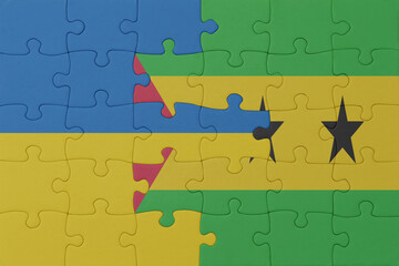 puzzle with the national flag of ukraine and sao tome and principe . macro.concept.