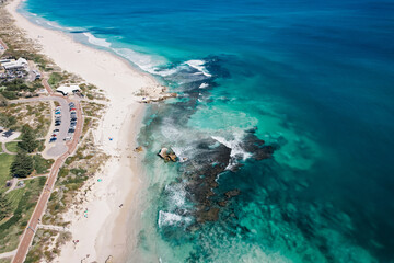 Aerial view of waves breaking over the reef at Trigg Beach in Perth, Western Australia