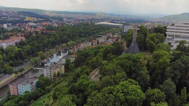 28.07.2019-Aerial view over Cluj-Napoca. Belvedere landscape cross located on hill named "Cetatuie", Grigorescu neighbourhood, BT Arena and Sala Polivalenta in background-4k footage 
