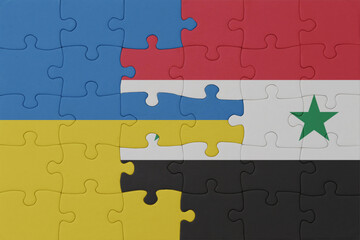 puzzle with the national flag of ukraine and syria . macro.concept.